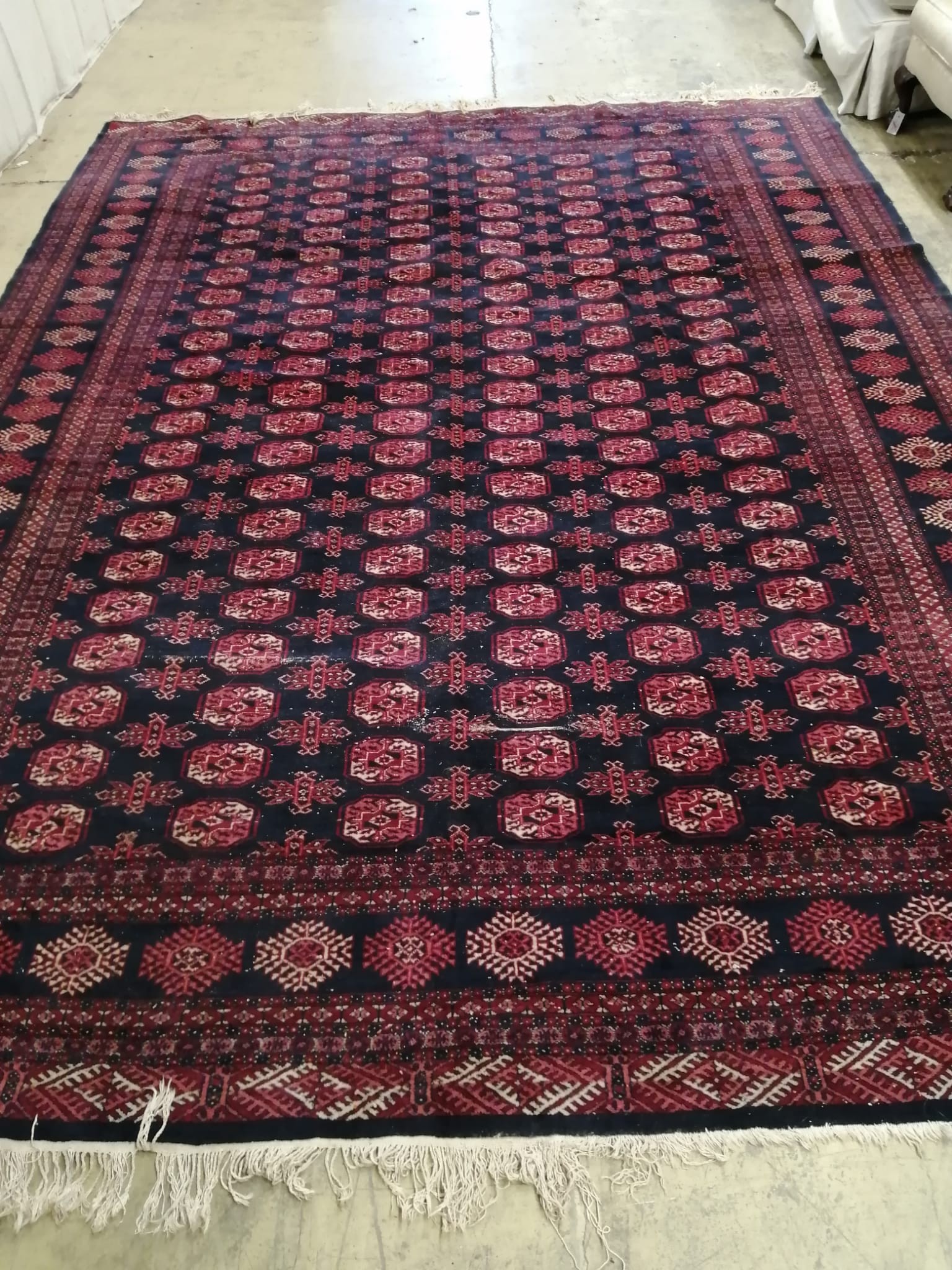 A Bokhara blue ground carpet, 370 x 280cm